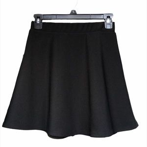black skirt with gold zipper